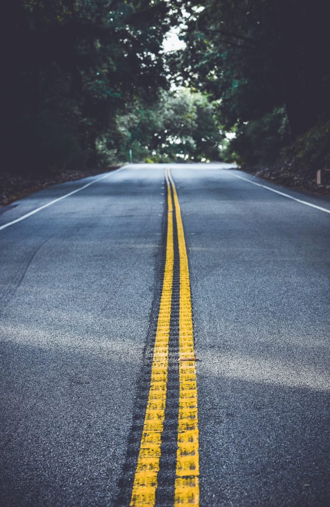 Two yellow lines running down the middle of the road